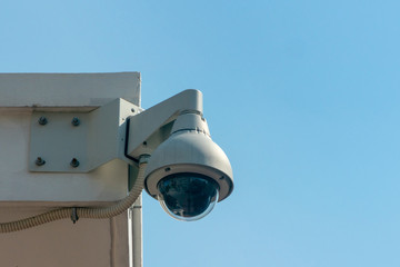 Security and video control camera on sky background.