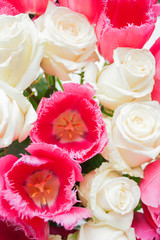 Bouquet with pink and purple poppy flower and white roses. Closeup background.