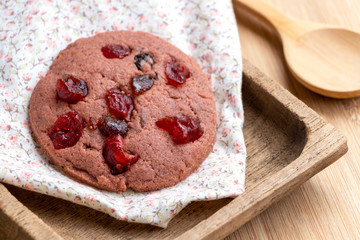Mixed fruits and gaba riceberry cookie isolated on wood table. Delicious homemade baked cookie.
