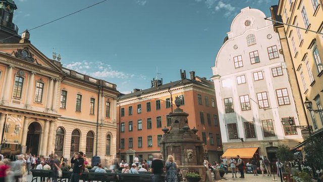 Stockholm, Sweden - June 29, 2019: Tourists People Walking Near Nobel Museum And Point 0 On Stortorget Square In Summy Summer Day. Famous Popular Place In Old Town Gamla Stan
