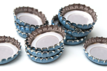 Closeup of metallic caps on white background