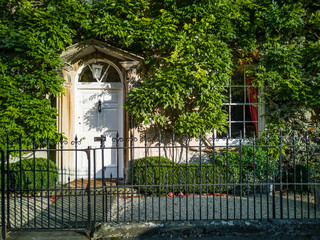 front of english house in autumn