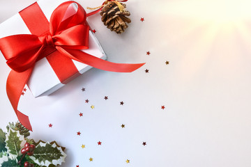 White Christmas gift red bow on table with yellow light