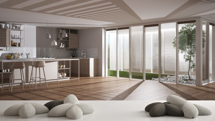 White table, desk or shelf with five soft white pillows in the shape of stars or flowers, over blurred modern wooden kitchen, white architecture interior design concept
