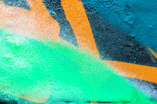 Beautiful bright colorful street art graffiti background. Abstract creative drawing fashion colors on the walls of the city. Urban  Culture, black , yellow, red , green, blue texture