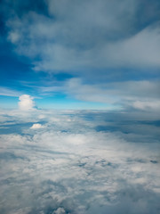 Sunrise above clouds from airplane window. Bright blue sky top horizontal view copyspace. Travelling concept View of the engine.