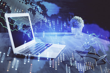 Financial market graph hologram and personal computer on background. Multi exposure. Concept of forex.
