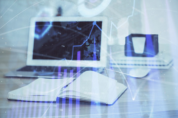 Stock market graph and table with computer background. Double exposure. Concept of financial analysis.