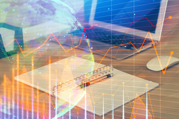 Multi exposure of graph and financial info and work space with computer background. Concept of international online trading.
