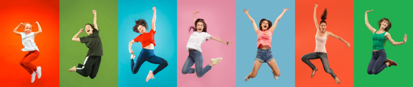 Young emotional people on multicolored backgrounds. Young surprised women jumping happy. Human emotions, facial expression concept, modern technologies. Trendy colors in collage. © master1305