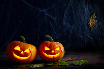 Halloween background with illuminated pumpkins.