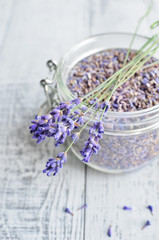 Obraz na płótnie Canvas natural lavender flowers and dried lavender buds in a glass jar