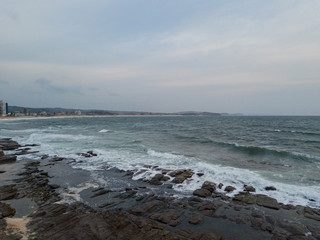Fototapeta na wymiar Empty rocky coastline on an overcast day.