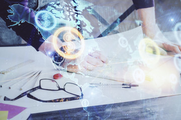 Multi exposure of man standing and planing investment with stock market forex chart.