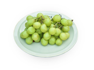 Green grapes on a white background plate