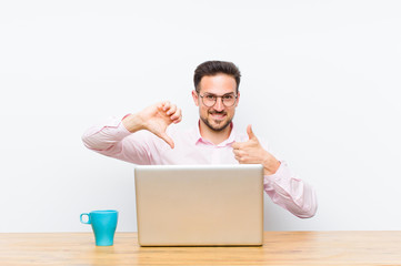 young handsome businessman feeling confused, clueless and unsure, weighting the good and bad in...
