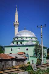 Fototapeta premium Small green mosque in Dalyan town, Mugla Province of Turkey