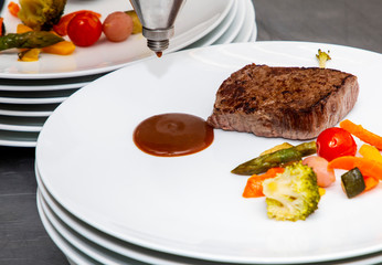french dish breaded beef with vegetables watered with sauce