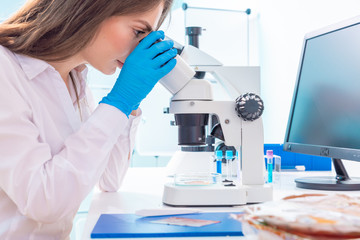 Young woman in food quality control lab