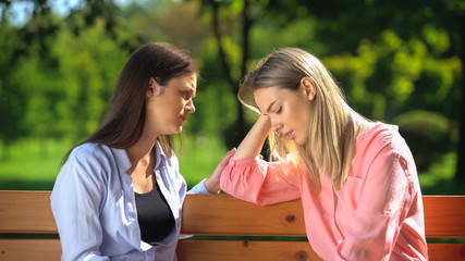 Kind woman comforting sad female friend, breakup crisis, friendship relations