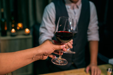 man with glass of red wine