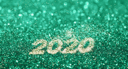 New 2020 year in golden glitter in trendy biscay green turquoise color