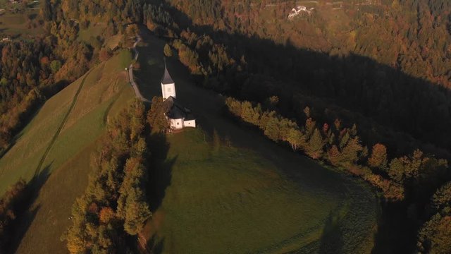 Autumn aerial view of a beautiful church on the top of a hill, in Slovenia