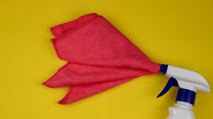 The concept of cleaning the room. Sprayer on a yellow background. Copy the image.