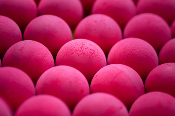 Little pink foam ball which is use to playing or throwing in kid playground. Close up and selective focus at the center ball surface.