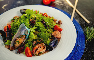 seadfood salad with mussels, fried shrimps and vegetables