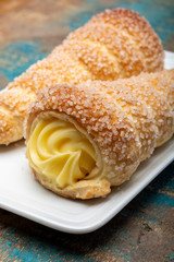 Filled with yellow cream homemade horn pastry