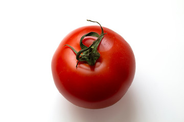Red tomato on white background