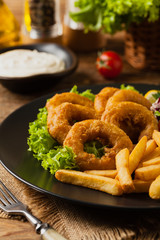 Roasted squid rings with fries.