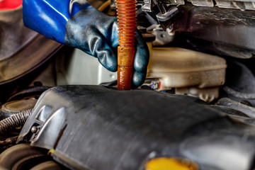 Change the engine oil at the service station.