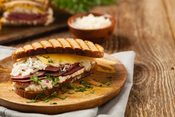 Ruben sandwich. New York sandwich with pastrami, sauce 1000 islands and sauerkraut.