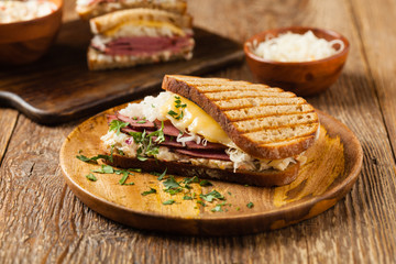 Ruben sandwich. New York sandwich with pastrami, sauce 1000 islands and sauerkraut.