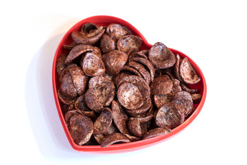 Chocolate cereal inside a heart shaped container