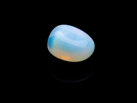 Opalite gemstone isolated on black  background. Macro shot