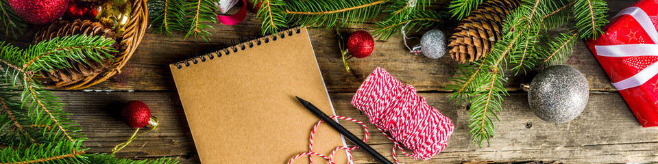 Christmas background with blank notebook for to-do list or wish list. with christmas fir branches,...