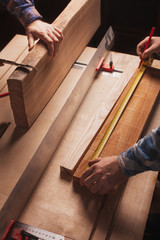Carpentry workshop background with male hands and tools