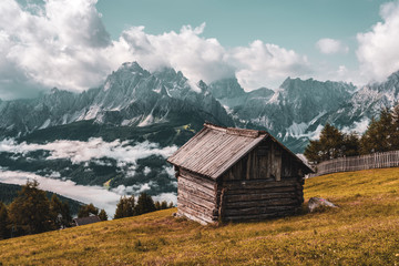 Fototapeta na wymiar old mountain hut, panoramic view of the Dolomites