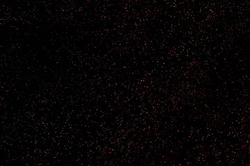 Many colored dots of different sizes on a black background. Background to create a starry sky. Outer space with colorful stars.