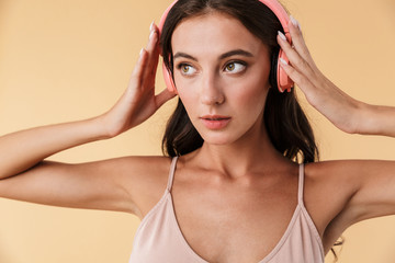 Fototapeta premium Portrait of a smiling beautiful sensual young brunette woman