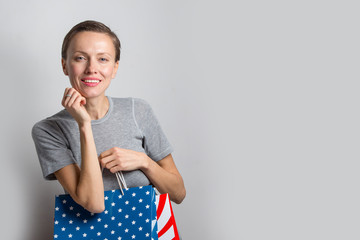  Beautiful shopping woman with shopping bags isolated over white background, copy space