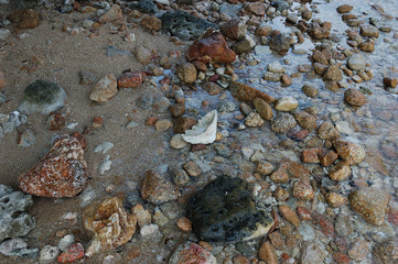 Big stones and pebble on the beach of Mae Haad, Koh Phangan, Thailand