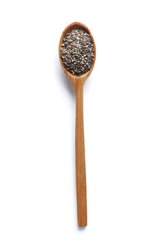 Сhia seeds in a spoon isolated on white background