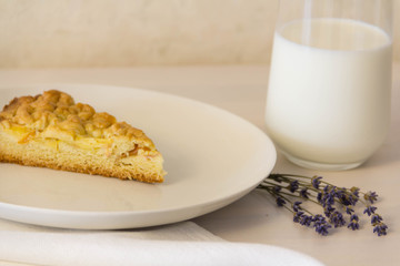 Slice of cake, milk and lavender, close-up