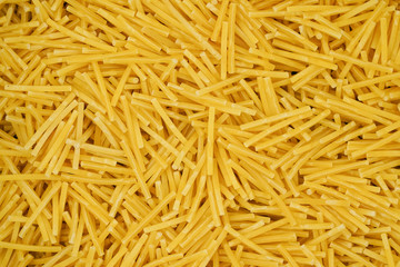 small pasta texture background closeup. vermicelli.  raw small noodles