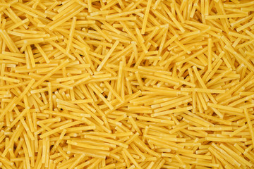 small pasta texture background closeup. vermicelli.  raw small noodles