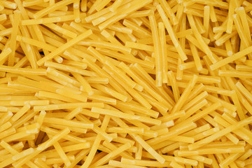small pasta texture background closeup. vermicelli.  raw small noodles